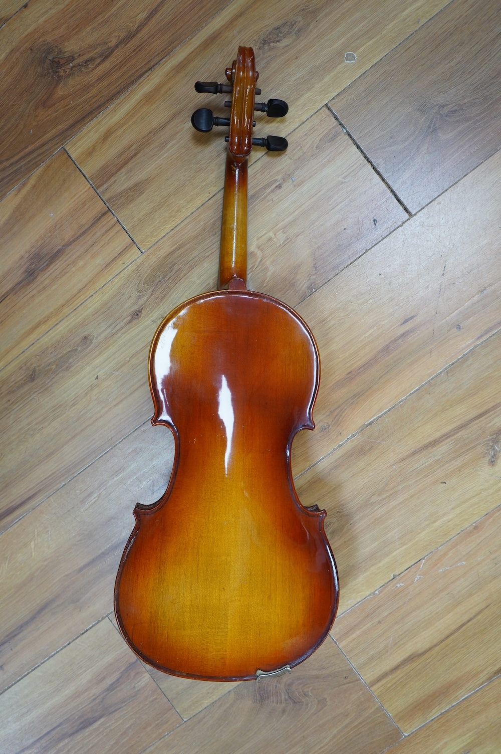 A cased Chinese viola, with makers label inside body which reads; ‘Made in Canton China’, body length 41cm. Condition fair to good.